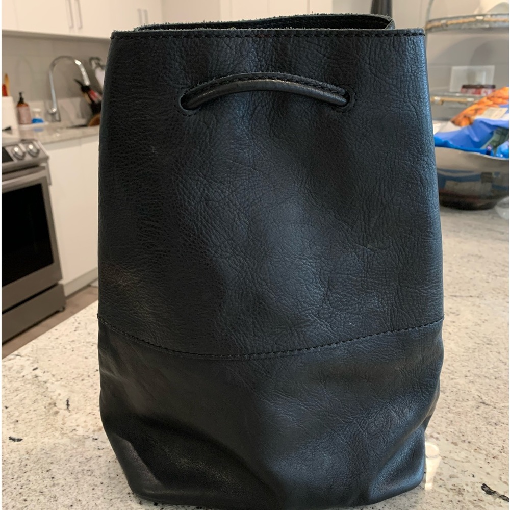 Fossil bucket style backpack or shoulder bag. Adjustable slider/tightner